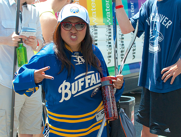 Gina Justine Galo brings the full-on Sabres experience, from jersey to hat to upstate New Yawk rawk. Photo by Jason Kurylo for Pucked in the Head.