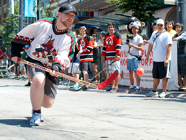 Ryan wears a Jeremy Roenick Peyote Coyotes jersey at the Five Hole for Food finale in Vancouver. Photo by Jason Kurylo for Pucked in the Head.