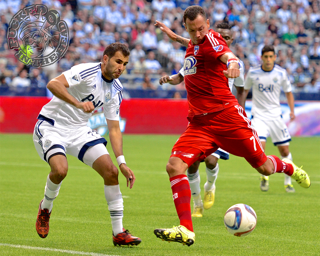 Blas Perez, now a member of Whitecaps FC, fires a left footer past Steven Beitashour, who is not. Outdated photo by Jason Kurylo for Pucked in the Head.