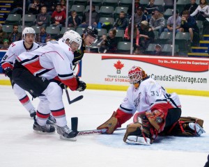 Barry Brust makes saves of all kinds for the Abbotsford Heat, including this athletic pad stop in traffic. Photo by Jason Kurylo for Pucked in the Head.