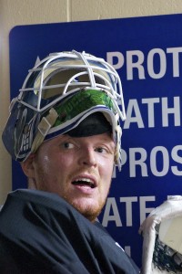 Vancouver Canucks goaltender Cory Schneider leans against the wall post-practice at UBC's Thunderbird Arena. He's entitled, after a 20-hour commute, a morning workout and a full practice with his NHL teammates. Photo by Jason Kurylo for Pucked in the Head.