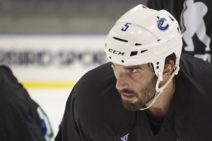 Perhaps the only moment during the January 8, 2013 Canucks practice that didn't feature Jason Garrison's 100-watt grin. Is this the game face he'll sport against division rivals this season? Photo by Jason Kurylo for Pucked in the Head.