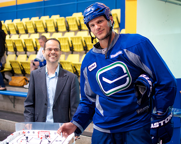 Kevin Bieksa is just one of the Vancouver Canucks who have signed part of the tournament grand prize. Register for $25 and you could walk away with a Stiga tournament-grade table hockey game! Photo by Jason Kurylo for Pucked in the Head.