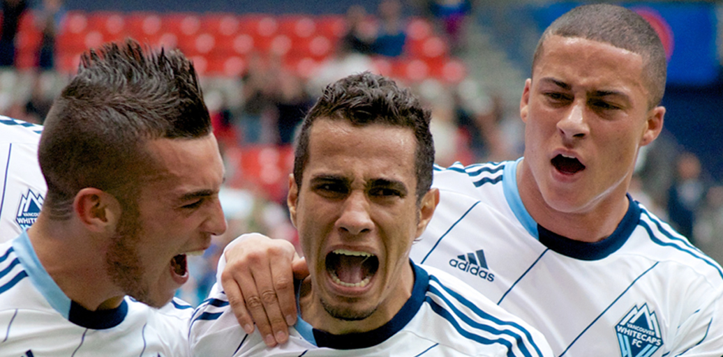 In happier times — you wouldn't know it by their expressions, but this was a celebration — teammates Russell Teibert and Erik Hurtado whoop it up for Camilo's Golden Boot winning goal in 2013. Photo by Jason Kurylo for Pucked in the Head.