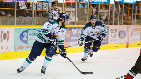 Surrey Eagles forward Brady Shaw carries the puck as game one hero Demico Hannoun looks on. Shaw had a goal and an assist in a 3-2 overtime win. Photo by Jason Kurylo for Pucked in the Head.