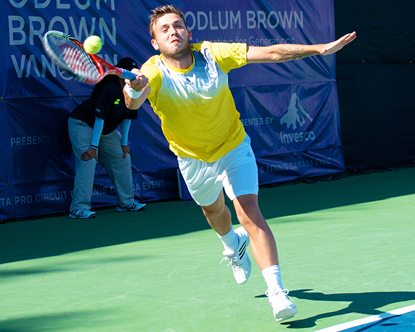 British tennis player Daniel Evans lunges for a Vasek Pospisil serve during the first set of play at the Vancouver Open men's final. Photo by Jason Kurylo for Pucked in the Head.