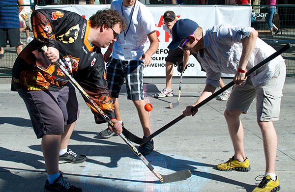 Pucked in the Head co-founder Chris Withers (left) sports the EFC Wolfsburg Grizzly Adams jersey I gifted him last fall at the 2013 Five Hole for Food finale. PITH Events Coordinator Andrew Delbaere managed to withhold his bile long enough to win this faceoff, Photo by Jason Kurylo for Pucked in the Head.