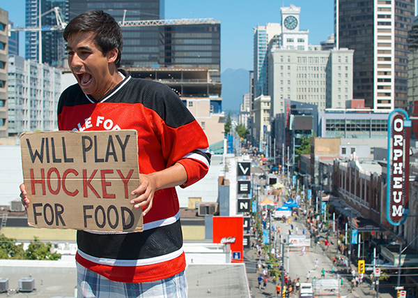 Five Hole for Food founder and CEO Richard Loat on a Granville Street rooftop overlooking his brainchild's 2013 edition. Even he is flummoxed by the growth of the event — but he always sees ways to grow it for next year. Photo by Jason Kurylo for Pucked in the Head.