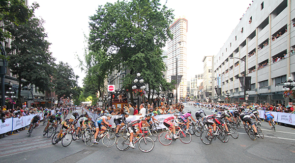 The peloton banks 180° from Water Street onto West Cordova during the 2012 Gastown Grand Prix, won by Ken Hansen. Photo courtesy of Greg Descantes, BC Superweek.