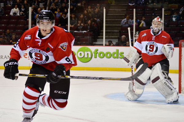 Vancouver Giants defenseman Mason Geertsen chases a loose puck as goaltender Payton Lee looks on during weekend action at the Pacific Coliseum. Photo by Jason Kurylo for Pucked in the Head.