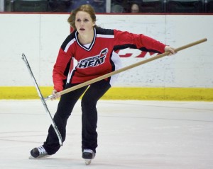 Abbotsford Heat ice crew member Kirsten goes deep into her hockey stride during a break in play on January 5, 2013. She plays intramural hockey at BCIT, and is in her third year of scraping the ice at Heat home games. Photo by Jason Kurylo for Pucked in the Head.
