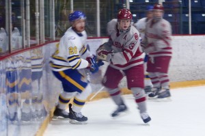 Sophomore Oklahoma Sooners defenseman Kevin Zehnder pins UBC Thunderbirds forward Wyatt Hamilton during Great Western Showcase action at Bill Copeland Arena on December 29, 2012. The Thunderbirds won the game 4-3 in overtime. Photo by Jason Kurylo for Pucked in the Head.