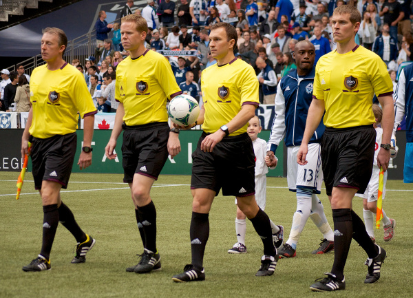 Referees are openly despised in most arenas around most leagues, but this crew received some especially lusty boos at the end of the Whitecaps - Timbers match. Yes, we at PITH suspect that linesman indeed always has his eyes closed like that. Photo by Jason Kurylo for Pucked in the Head.
