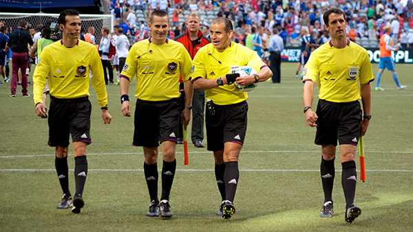 Referee Baldomero Toledo (with ball) and officiating crew walk off the field to a chorus of boos after Whitecaps FC drop a 1-0 decision to the Philadelphia Union. Photo by Jason Kurylo for Pucked in the Head.