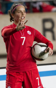 Team Canada defender Rhian Wilkinson directs traffic prior to a throw-in during an international friendly. Photo courtesy of Soccer Canada.