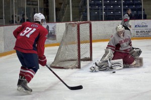 Sophomore goaltender Colin Fernandes makes a first-period save during SFU's only power play of the night on December 28, 2012. The Surrey-born netminder allowed four goals in the Sooners 4-0 loss to the home team at the Great Northwest Showcase at Bill Copeland Arena. Photo by Jason Kurylo for Pucked in the Head.