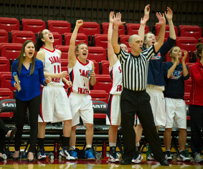 The SFU Clan women's basketball bench cheers a three-pointer during GNAC conference final action last weekend. Photo from the SFU Athletics website.