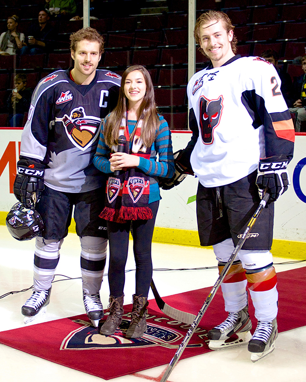 Vancouver Giants captain Dalton Thrower stands with his siblings, anthem singer Danae and Calgary Hitmen defenseman Josh, prior to WHL action at the Pacific Coliseum. Photo by Jason Kurylo for Pucked in the Head.