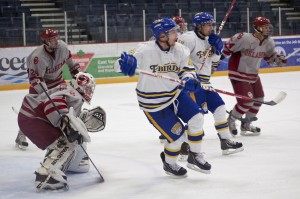 Sophomore Oklahoma Sooners goaltender Colin Fernandes looks through the UBC Thunderbird screen during a sustained period of attack on December 29, 2012. The Thunderbirds scored an overtime goal to win the game 4-3. Photo by Jason Kurylo for Pucked in the Head.