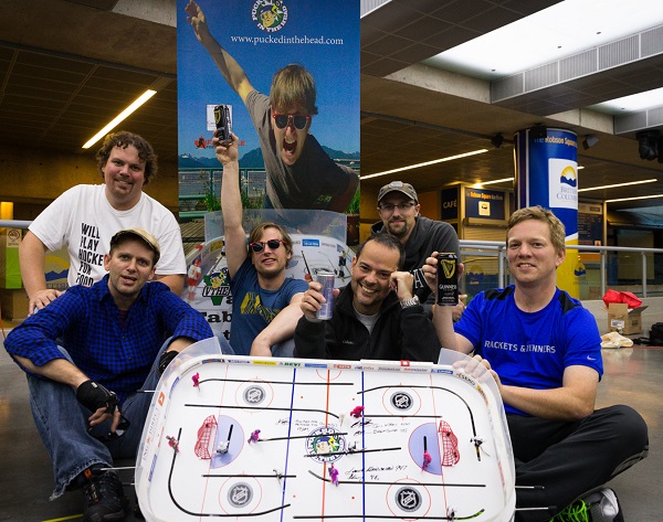 Chris Withers, Jamie Macdonald, Derek Macdonald, Dr Rob Tarzwell, Brent Corba and Jason Kurylo celebrate setting the world record for the longest continuous table hockey game on September 20-21, 2013. Photo by Clint Trahan/ShutterDreams.