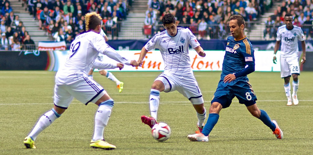 Matías Laba blocks a clearing attempt during a 2-2 draw between the Whitecaps and LA Galaxy. Photo by Jason Kurylo for Pucked in the Head.