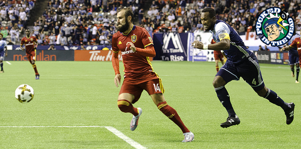 Kendall Waston chases down Yura Movsisyan.