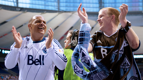 Whitecaps FC ambassador Carl Valentine and Southsiders scarf collector Kristjan Hau lead a song during MLS play on 15 June 2013. Photo by Jason Kurylo for Pucked in the Head.