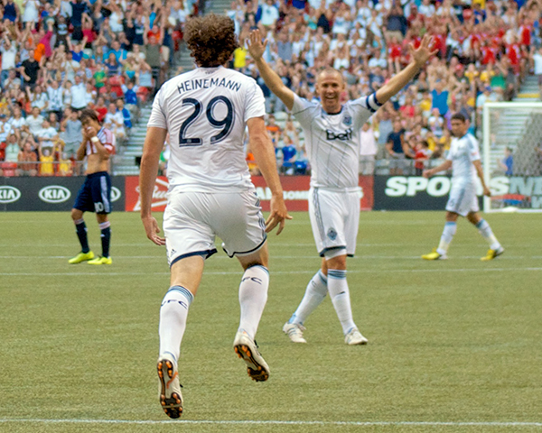 Tommy Heinemann celebrates the tying goal against Chivas USA as Kenny Miller congratulates him. Photo by Jason Kurylo for Pucked in the Head.