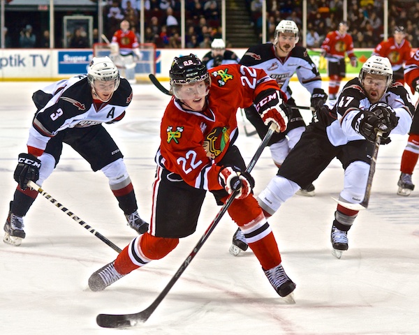 Alex Schoenborn opened the scoring for the Portland Winterhawks, who took a 5–4 shootout victory from the Vancouver Giants Sunday night. Brett Kulak and Dalton Thrower watch on. Photo by Jason Kurylo for Pucked in the Head