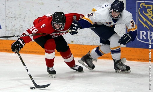 Stephanie Schaupmeyer (#3, R) scored in double overtime to send the Canada West final to a third and deciding game. Photo by David Moll for U of C.