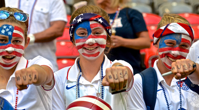 Three American fans show off face paint and knuckle hashtags. Photo by Jason Kurylo for Pucked in the Head.