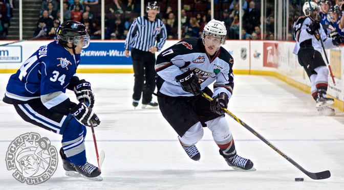 Tyler Benson of the Vancouver Giants wheels into the offensive zone, eyed up by defenseman Alexey Sleptsov. Photo by Jason Kurylo for Pucked in the Head.