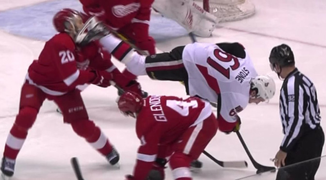 Drew Miller is hit by Mark Stone's skate during NHL action Tuesday night.